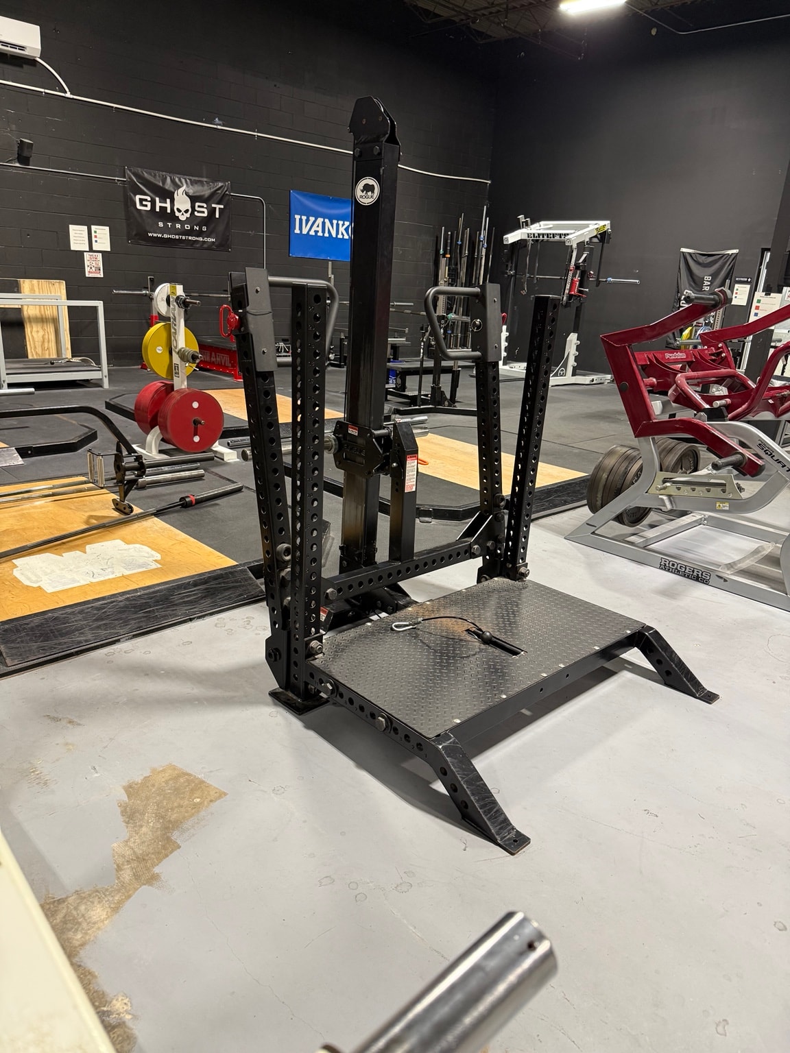 Weight rack and machines at Full Tilt Barbell Club