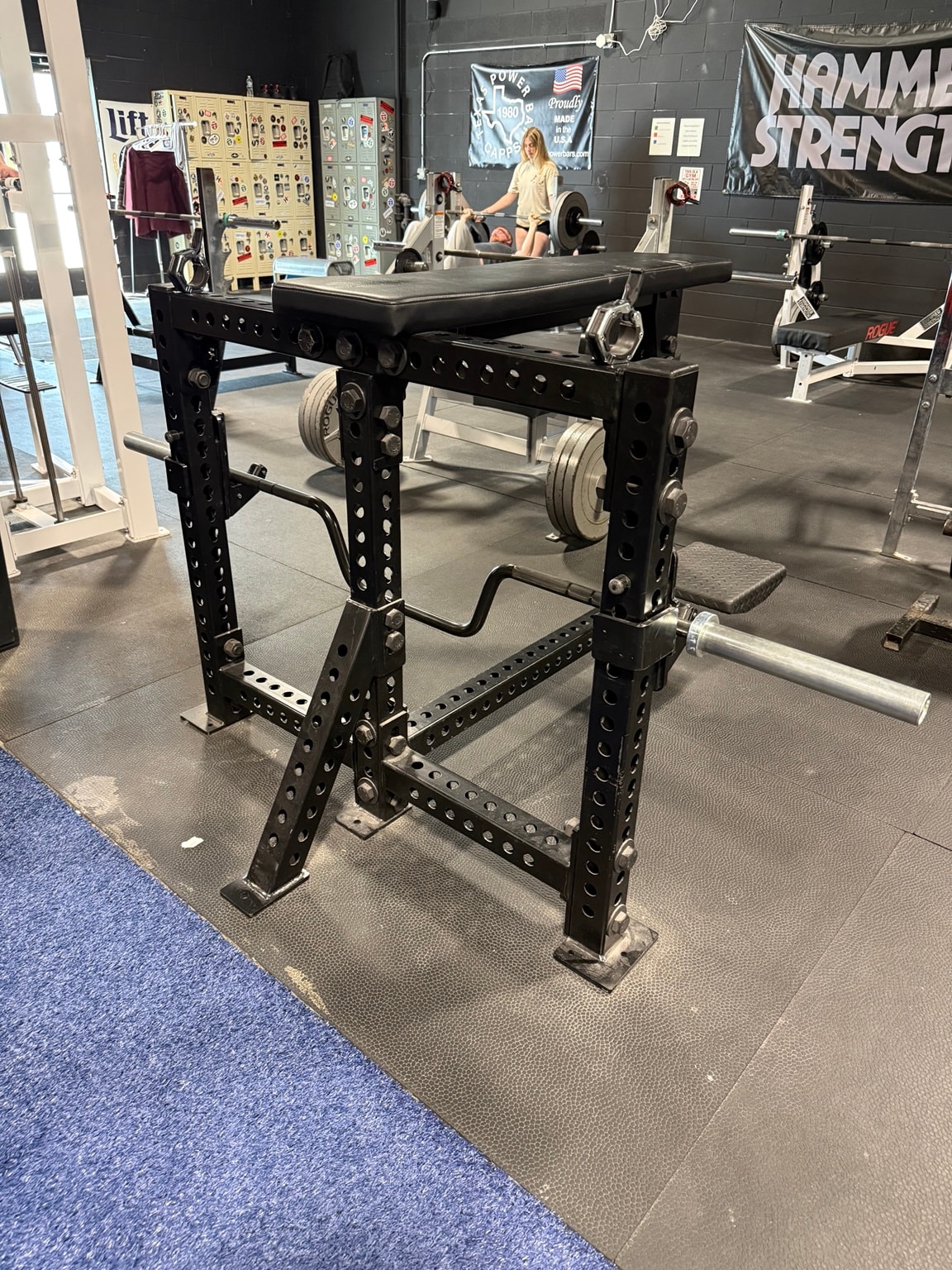 Rogue squat rack with barbell at Full Tilt Barbell Club