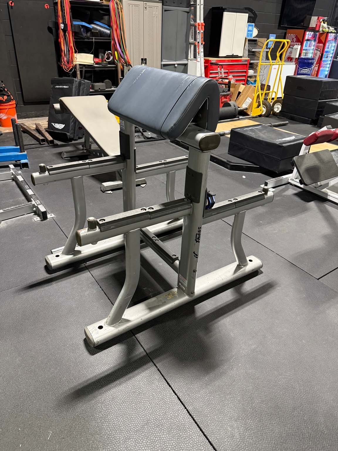 Preacher curl bench at Full Tilt Barbell Club