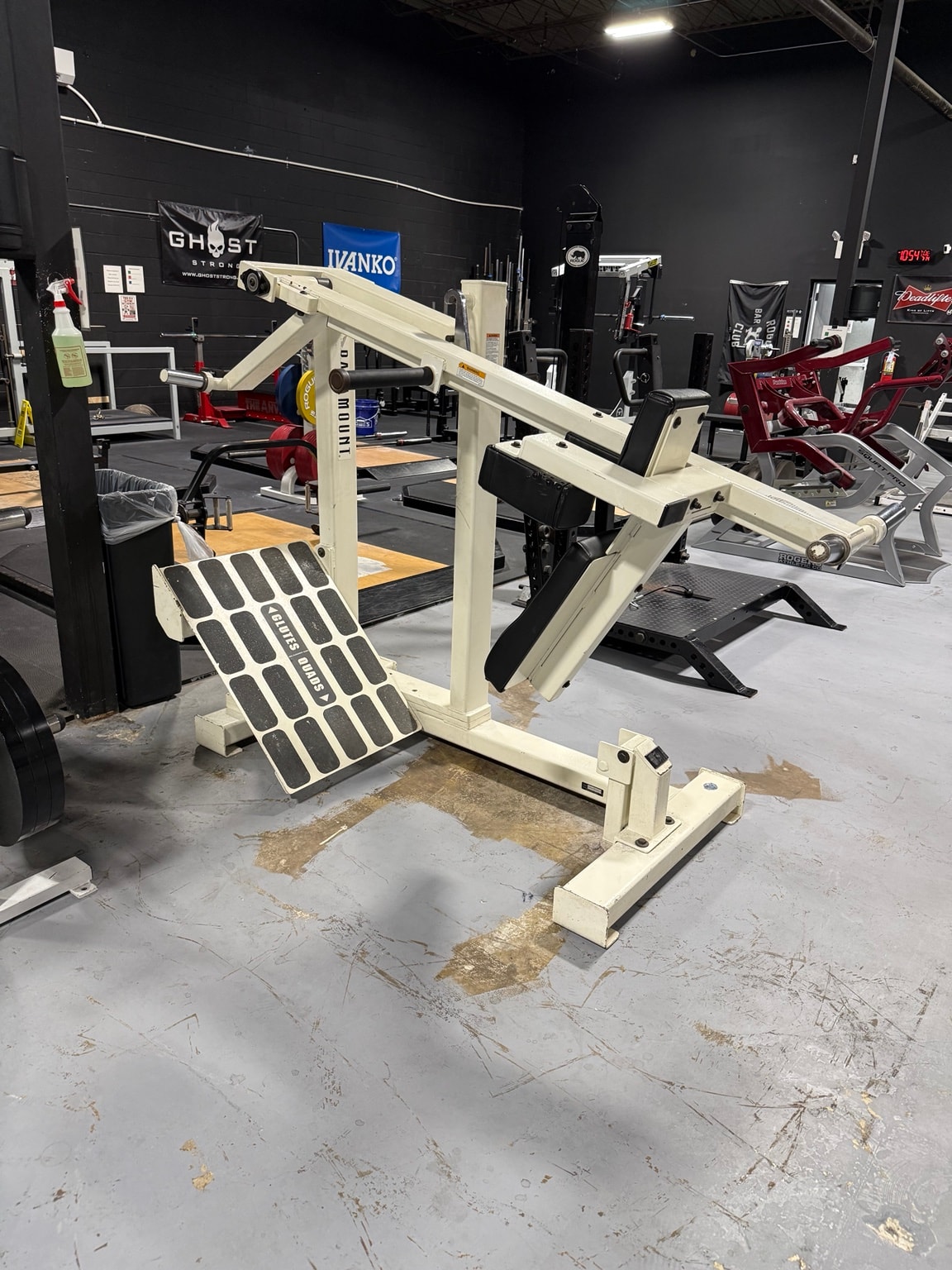 Plate-loaded squat machine at Full Tilt Barbell Club