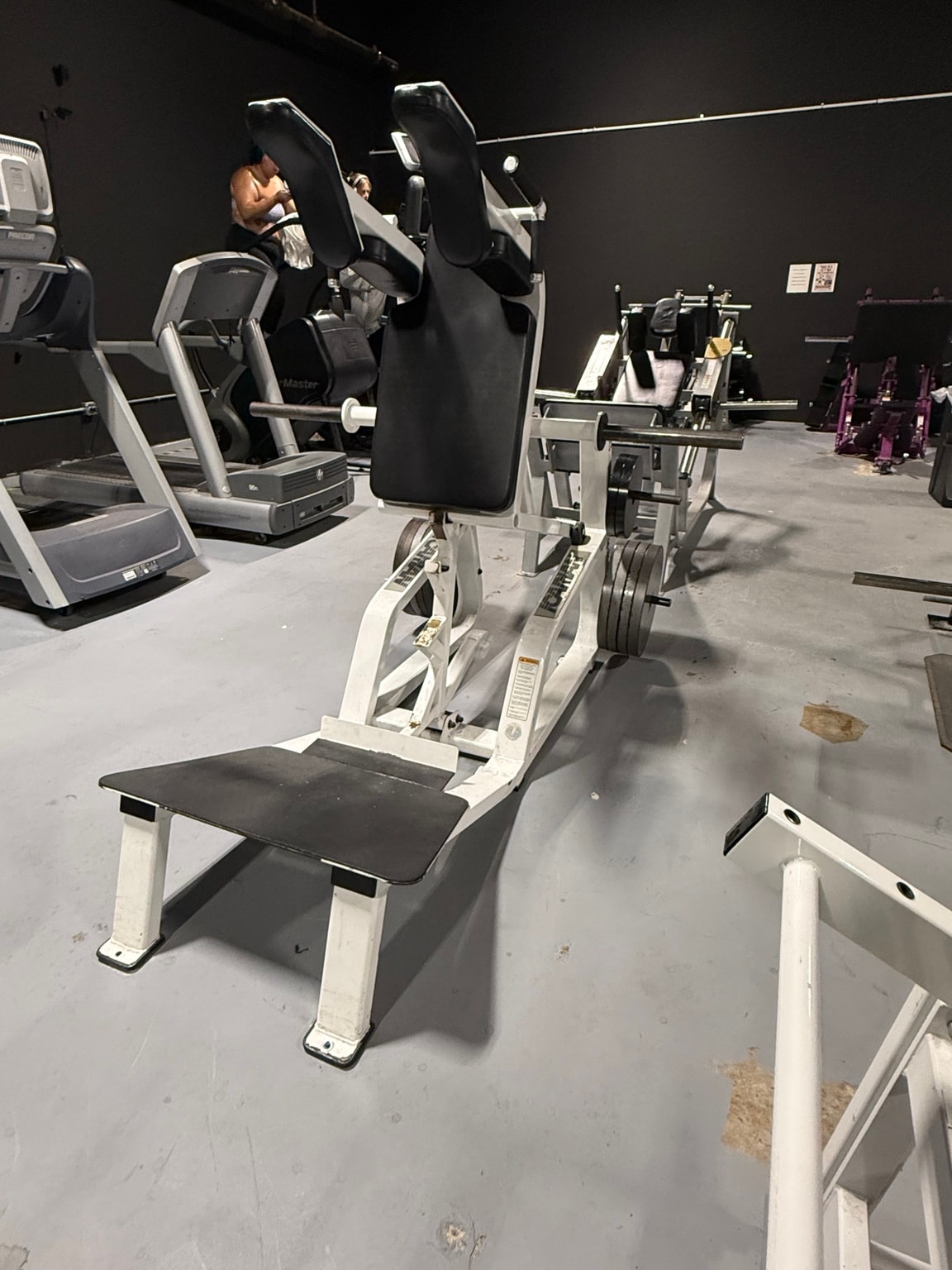 Plate-loaded leg press machine at Full Tilt Barbell Club