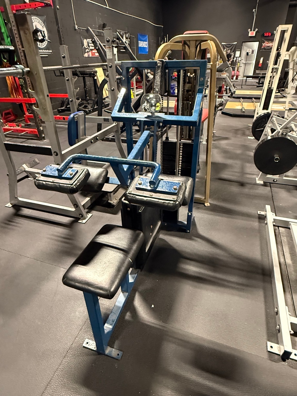 Blue seated row machine at Full Tilt Barbell Club